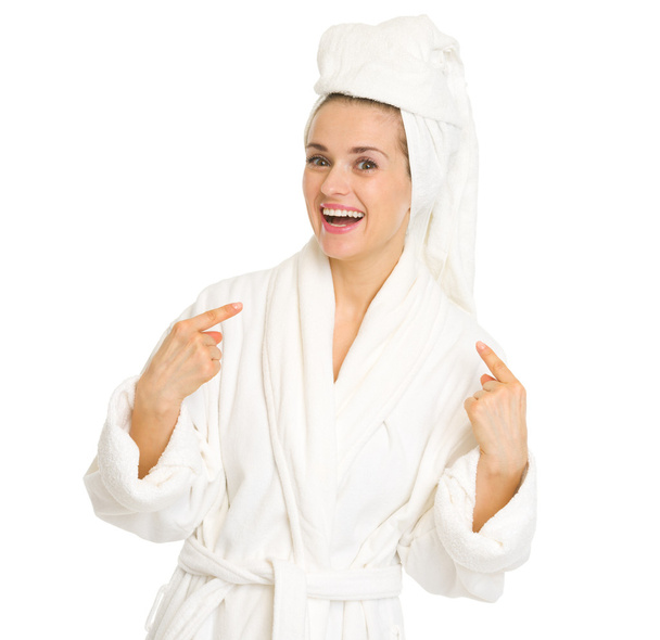 Woman in bathrobe pointing on herself - Foto, imagen
