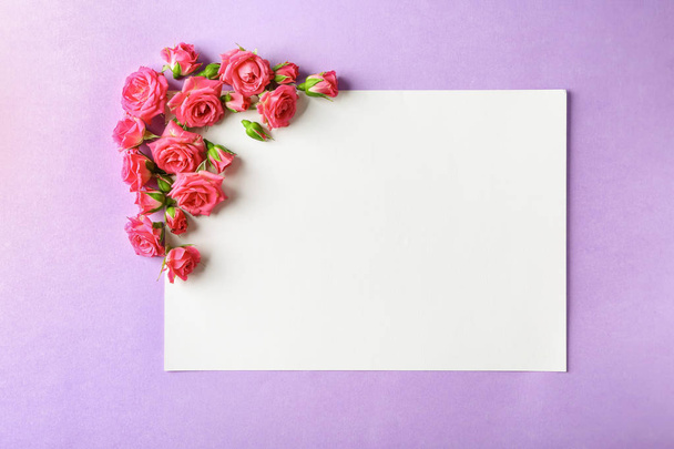 Beautiful blooming flowers and empty card on color background - Photo, Image