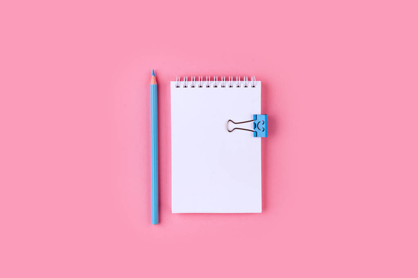 Top view of Blank notebook with peb on colorful background pink with copy space. - Foto, Imagen