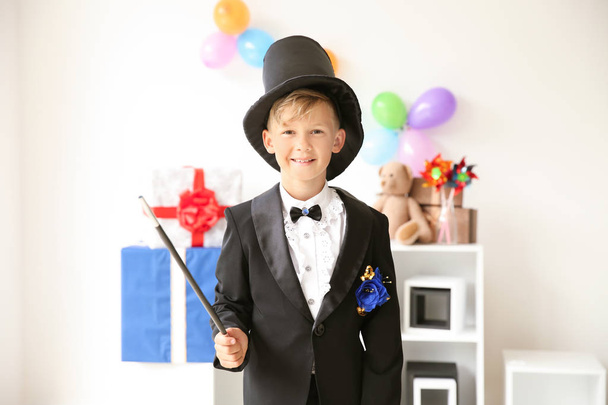 Cute little magician indoors - Photo, Image