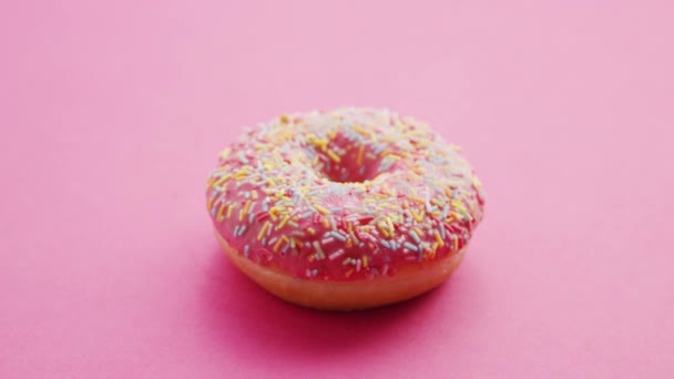 Sweet pink glazed doughnuts - Footage, Video