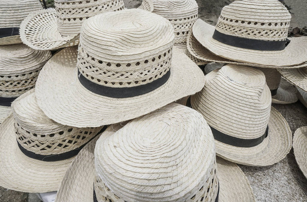 pile of straw hats as a background - Photo, Image