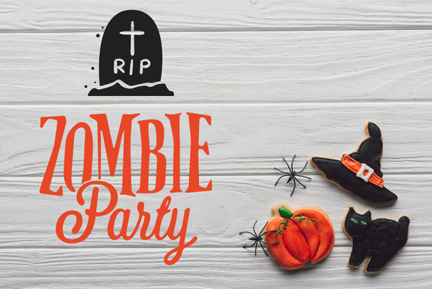 elevated view of tasty homemade halloween cookies on wooden background  with "zombie party" lettering - Photo, Image