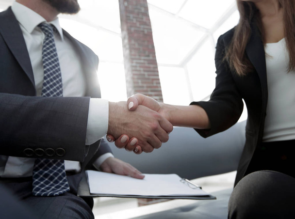 Close-up of two business people shaking hands - Photo, Image