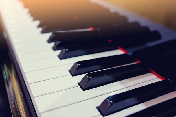Top view of instrument musical tool. Close up to the piano keyboard background with selective focus. Classical music with black and white key. - Foto, imagen