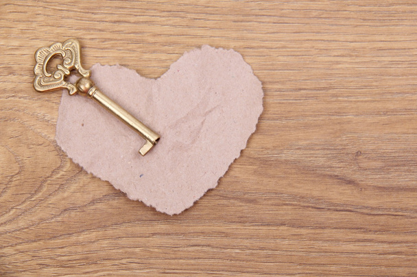 Metal key and the symbol of the heart - Zdjęcie, obraz