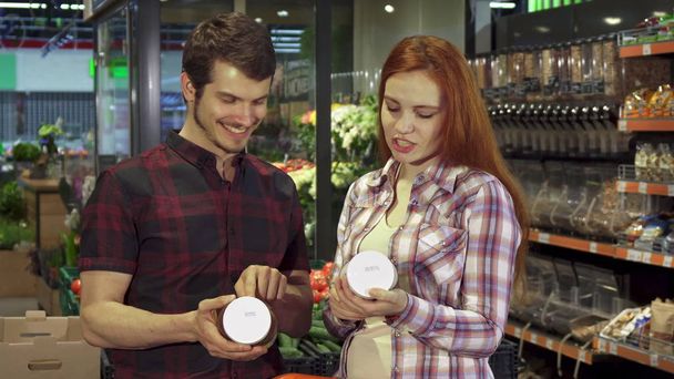 Couple argues about the food composition data - Photo, Image
