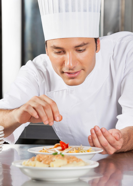 Chef Sprinkling Spices On Dish - Photo, image