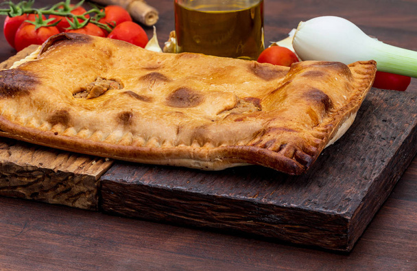 Tuna pie. Typical Galician dish (Galicia) and Spain. With natural ingredients such as tomato, onion, pepper, eggplant, tuna, boiled egg, wheat and vegetable oil. Fish and vegetables cake. - Photo, image