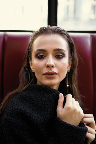 Gorgeous young brunette woman in black clothes posing - Fotografie, Obrázek