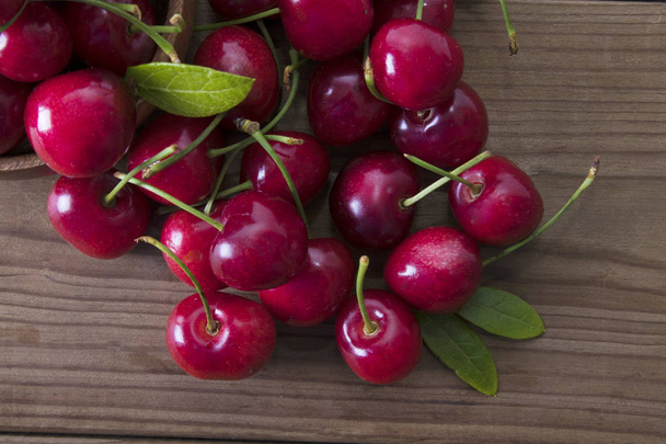 red cherries on rustic wood - Photo, Image