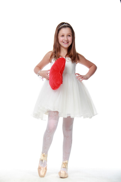 A little girl in a white dress - Foto, afbeelding