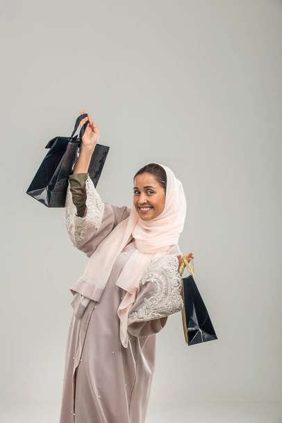 Portrait of arabic woman with abaya dress in a studio - Foto, immagini