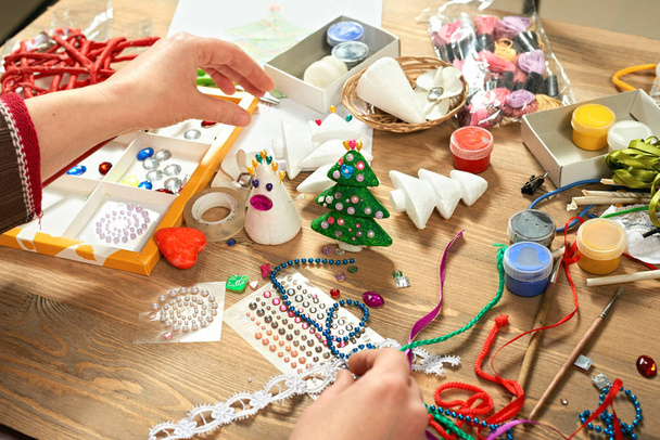 Childrens making decorations for new year holiday. Painting watercolors. Top view. Artwork workplace with creative accessories. - Photo, Image