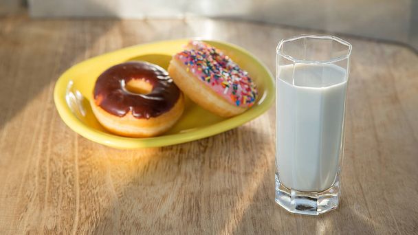 Delicious donuts with cup of milk - Photo, Image