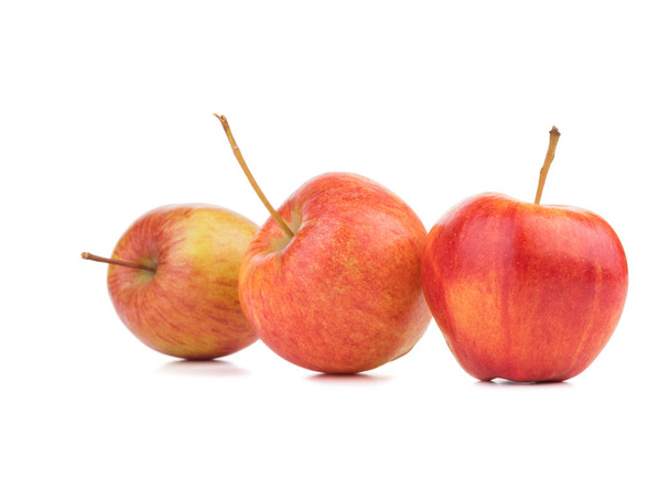 Three juicy, fresh and organic apples isolated on a white background. Healthy fruits full of vitamins. - Φωτογραφία, εικόνα