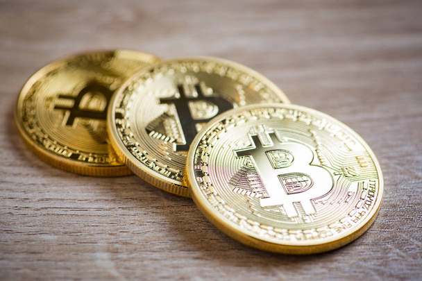 Golden bitcoins on wooden background - Foto, Imagem