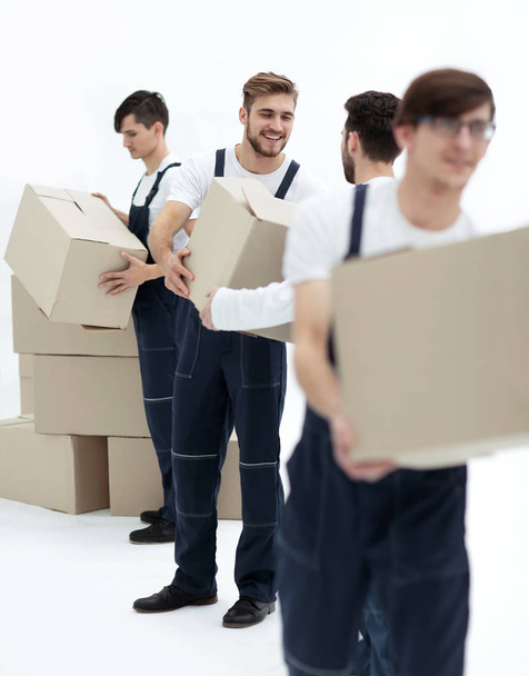 Men delivering box isolated on white. - 写真・画像