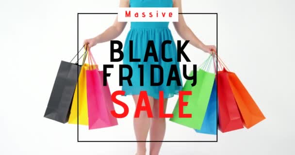 Digitally generated video of black friday sale and woman walking with shopping bags 4k - Кадри, відео