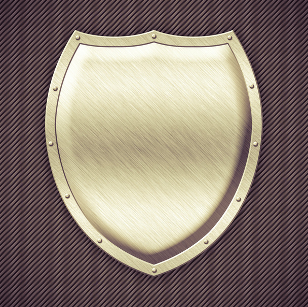 Aged metal shield on carbon background - Foto, Imagem