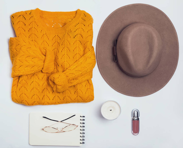 Autumn flat lay with feminine clothes on the white background - Foto, imagen