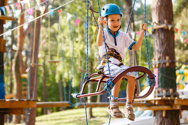 little boy having fun in rope park - Foto, imagen