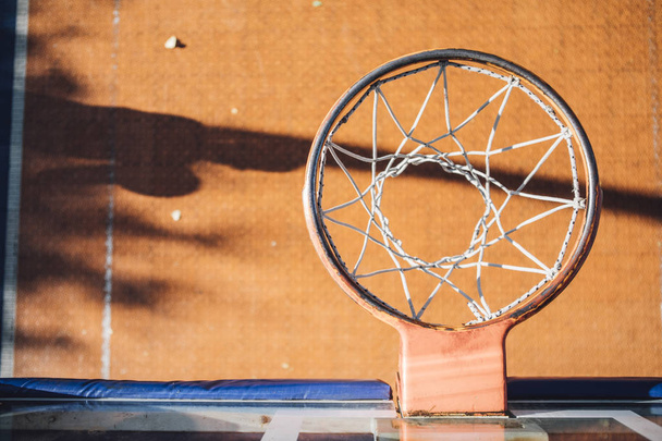From above photo of basketball ring on outdoor court. - Fotó, kép