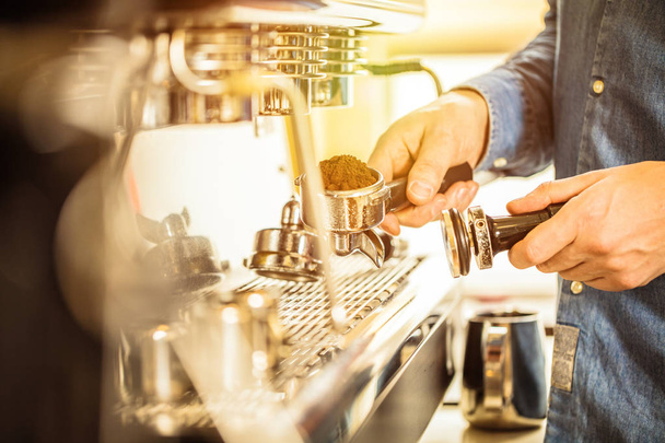  Barista using coffee machine for making coffee in the cafe - Photo, Image