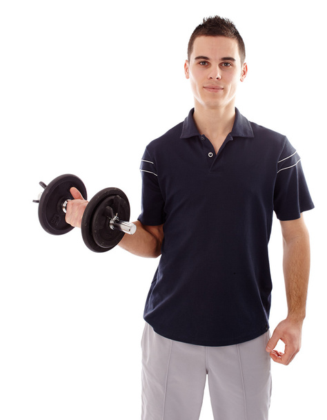 Young man lifting a dumbbell - Photo, image