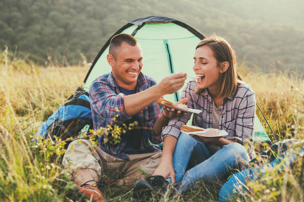 Happy couple is camping in mountain.  - Foto, Imagem