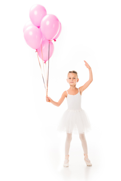 beautiful little ballerina in tutu dancing with pink balloons isolated on white background  - Fotoğraf, Görsel