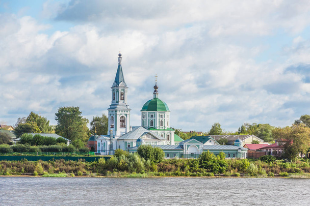 St. Catherine's convent. Russia, the city Tver. View of the monastery from the Volga river. Picturesque clouds in the sky. Summer or autumn day. - Photo, image