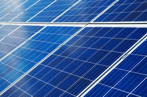 Close-up view of blue solar panels. Renewable energy. - 写真・画像