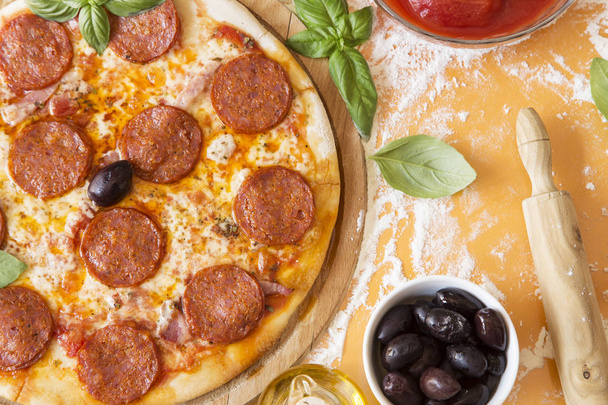 Pepperoni pizza with the ingredients from above - Fotó, kép