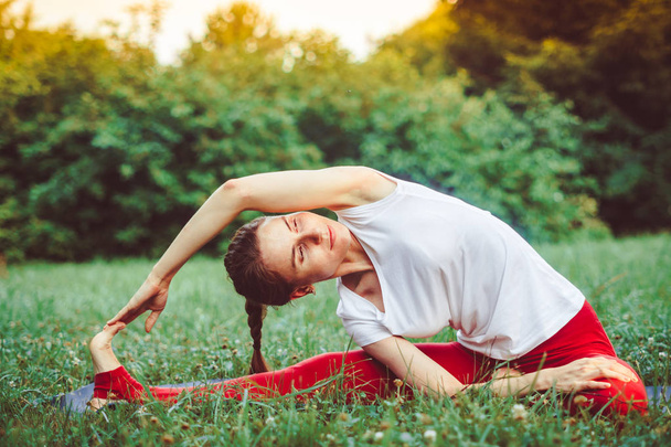 girl doing yoga outdoors - Photo, image