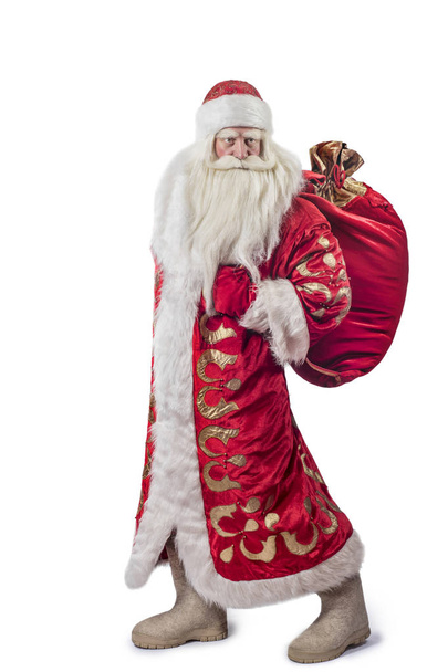 A traditional Christmas Santa Clause with staff isolated on white background - 写真・画像