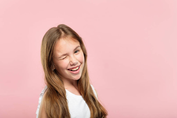 emotion face smiling cute adolescent girl winking - Photo, image