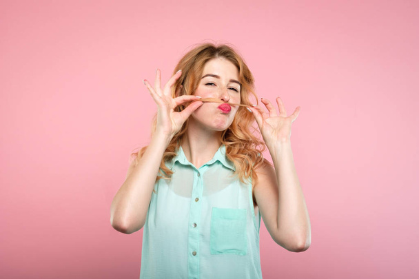 funny playful carefree girl fooling hair mustache - 写真・画像