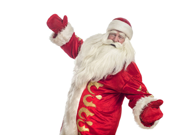 Deze Santa Claus feliciteert op een witte achtergrond - Foto, afbeelding