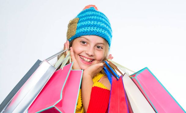 Girl amazed face knitted hat hold shopping bags white background. Amazing shopping concept. Buy clothes amazing discount. Get promo code. Amazing sale and discount. Shopping on black friday - Foto, Imagem