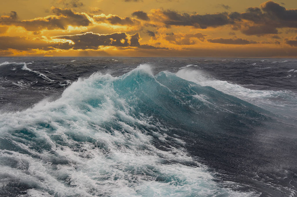 sea wave and dark clouds during sunset in atlantic ocean - Photo, Image