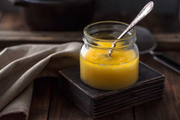 Ghee or clarified butter in a jar. - Фото, изображение