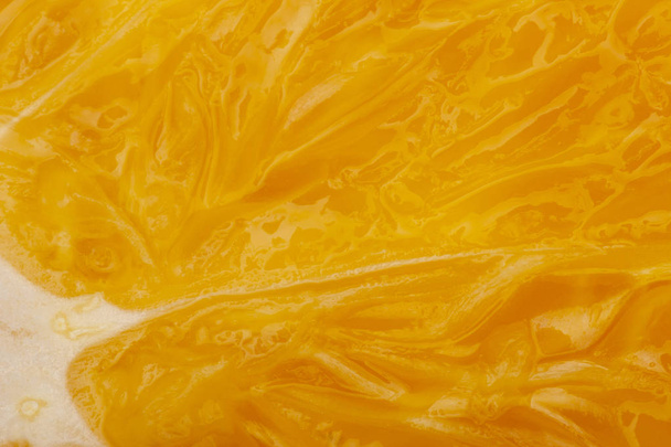 Flesh of juicy ripe orange as background or backdrop close-up Limited depth of field - Фото, зображення