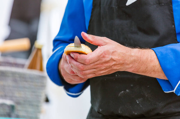 Chef cutting fresh bread for Burger  - Фото, зображення