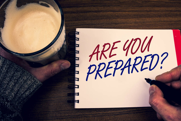 Word writing text Are You Prepared Question. Business concept for Ready Preparedness Readiness Assessment Evaluation Words notepad hands jumper holding open pen coffe glass desk sketch quick. - Photo, Image