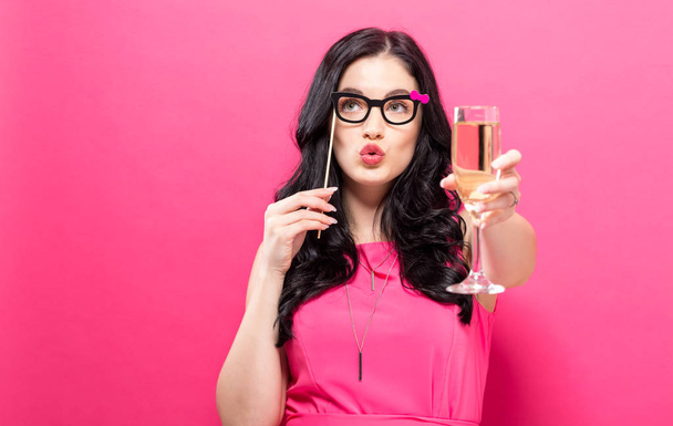 Woman with champagne and party stick - Foto, Imagen