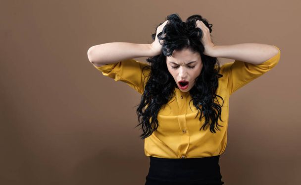 Young woman feeling stressed - 写真・画像
