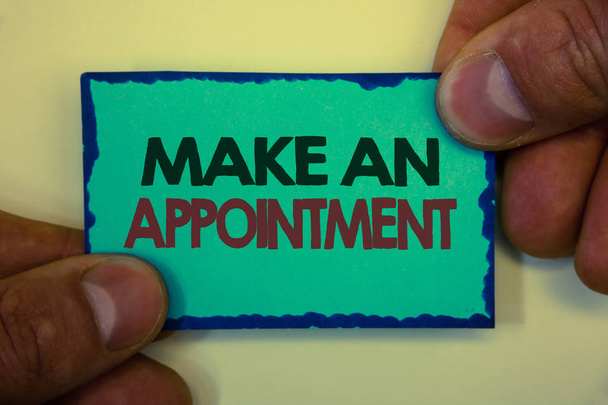 Writing note showing  Make An Appointment. Business photo showcasing Schedule Arrangement Deadline Session Engagement Greyish backstage man hand retain blue outskirts page showing words. - Photo, Image