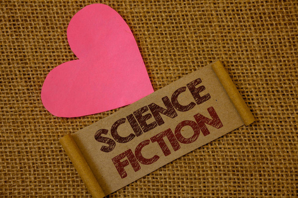 Handwriting text Science Fiction. Concept meaning Fantasy Entertainment Genre Futuristic Fantastic Adventures Ideas on old vintage paper black red letters wicker background pink heart. - Photo, Image