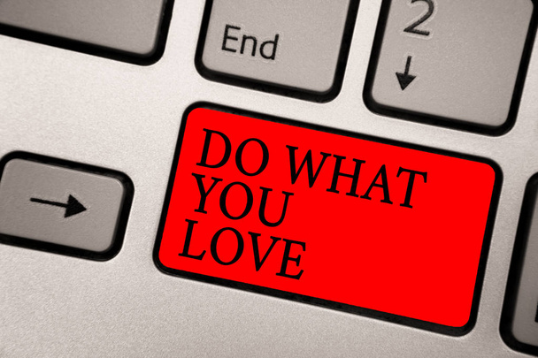 Conceptual hand writing showing Do What You Love. Business photo text Make enjoyable things do activities with motivation Greyish silver keyboard with red color button black color texts. - Photo, Image